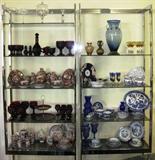 Mid-Century Modern "Milo Baughman" Flat Bard Chrome Wall Units (4 in all, 2 not shown) with smoked glass Adjustable shelves.
Also featured, (Left top to bottom) Princess House Crystal
Shelf 2: Avon Cape Cod Ruby 
Shelf 3: Japanese MORIAGE - Dragon TEA SET - “Elders/ Immortals” MEIJI c1868-1912
Shelf 4:  Avon Cape Cod Ruby Glassware
Shelf 5:  Modern Oriental Teaset,  Antique Geisha Girl Dinnerware Pieces

Right Shelf:  Vintage Amber Vases, Large Blown Art Glass Cobalt Blue Vase,  Amber bowl-crystal stemmed clairets
Shelf 2:  Victorian Plate & bowl, Handpainted Enamel Cobalt Bohemian Liqueurs and Blue & White Willow ware Sugar & Creamer 
Shelf 3:  Occupied Japan Willow Ware Dinnerware
Shelf 4:  Avon by Fostoria Cobalt Blue Martha & George Washington Goblets, Woods & Sons “YUAN” Blue & White Transferware China