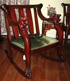 Victorian Mahogany Rocker with Wide Slat Back.  Arms with Lions Head cruved down to Paw Feet.  Part of 3 piece Victorian Settee Grouping