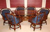 Wicker by Henry Link - Lexington NC Bamboo dinning Set: &nbsp;Bamboo Base Table with Oval Glass (64" x 37 1/2") Top & Set of 6 bamboo Swivel Base Arm Chairs on Casters w/blue Upholstered Removable Back & Seat Cushions