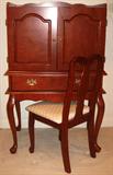 Cherry Finish Cabinet/Desk. Monitor sts behind double doors eith a lower pull raised on cabriole Legs