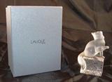 Lalique&nbsp;clear and frosted crystal kitten standing on a block&nbsp;figurine with paws up.  Produced by Lalique and&nbsp;discontinued in 1980
Original Lalique&nbsp; Signed with engraved script signature "Lalique, France"and dated on bottom of base.&nbsp;
Measures&nbsp;5 5/8"&nbsp;high,&nbsp;3 1/4"&nbsp;long and&nbsp;2 1/2"&nbsp;wide.