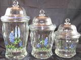 Set of three glass canisters depicting Texas Blue Bonnets