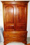 Sumter Cherry Double Door Armoire with 2 Large Lower Drawers Raised on Bracket Feet