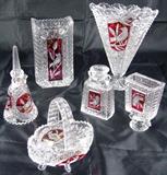 Byrdes by Hofbauer- Bleikristall Crystal Co. of West Germany. The Hofbauer Byrdes Collection is made from high quality 24% lead crystal. It has the famous bird cut into a red panel on each side: Retangular Shaped Vase, Large Footed Fan Vase, Bell, Basket and a pair of Reversible Candle Holders. The Hofbauer Crystal Co. produced collectible lead crystal in the mid- to late 1900s. Though the company is now defunct, their lead crystal pieces have remained very popular.