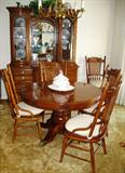 Thomasville "Golden Era" Dinning Room Suite reflecting turn of the Century America.   Round Pedestal Table 48" Dia & Extends to 88"  including two 20" Leaves Complete with Storage Bags for Leaves and custom Table Pads.
Set of 6 Chairs (4 side chairs and 2 arm chairs.)

Thomasville "golden Era" Cina Cabinet;  Base 9-Drawer Cabinet with 1 Center Door (62"W x 22"D x 35"H) topped  with Collector's Deck (61"W x 18"D x 46"H) 3 Adjustable Glass Shelves Behind each of 2 Curved Glass Doors.  Center Section has a Etched Glass Mirror Back with 2 Adjustable Glass Shelves.  Each Section is Lighted