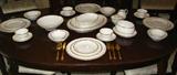 Noritake Ivory china with Gold Rim "Dignatio" 7 piece Place Setting Servive for 12: Dinner Plate, Salad Plate, Bread & Butter Plate, Dessert/Cereal Bowl, Berry/Fruit Bowl, Cup & Saucer.
Serving Pieces: Platters12 3/8" & 14 7/8", Round Vegetable Bowl 8 3/4", Oval Vegetable 8 5/8", Gravy Boat w/Attached Underplate, Sugar Bowl w/lid and Creamer