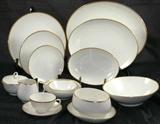 Noritake Ivory china with Gold Rim "Dignatio" 7 piece Place Setting Servive for 12: Dinner Plate, Salad Plate, Bread & Butter Plate, Dessert/Cereal Bowl, Berry/Fruit Bowl, Cup & Saucer.
Serving Pieces: Platters12 3/8" & 14 7/8", Round Vegetable Bowl 8 3/4", Oval Vegetable 8 5/8", Gravy Boat w/Attached Underplate, Sugar Bowl w/lid and Creamer