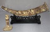 Scrimshaw Bone Oriental Sabre Sheath with Immortals on a Black Display and and a Dragon Sabre Handle Standing in front