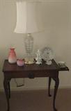 One of a pair Mahogany Association solid mahogany tea table with slide out teacup rest on either end.
Shown with Crystal lamp w/ handmade Nicoletti shade