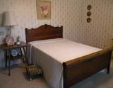 Antique Oak Full Size Bed show with Antique Oak Parlor Table, Blanc d'Chine White Lamp, & Tapestry Foot Stool