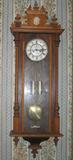 1985 Wall Clock Walnut Case, Cornice Pediment (Top Crown added & not origina)& Carved Column. Chased Brass Weights and Pedulum. Simular clock featured in American Shelf & Wall Clock 1999 by Robert W. D. Ball