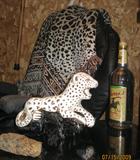 Leopard Figurine with Leopard Throw and Rattle Snake hide in fore ground