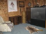Vewi of Room with RCA 64" TV, Bone Leather Recliner, Antiqu Oak Low Boy, Gun Cabinet, Etc