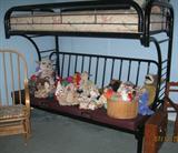 Black Metal Bunk Bed with Futon show with Various soft sculptured toy animals