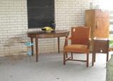 A fifty, sixty view of oval Oak Table, Arm Chair, Oak Smoke Stand, Old GE Refrigerator and more