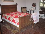 Aoverall View of Bedrooom Showing Antqiue bed and Primitive Folding Quilt Rack