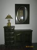 Antiqued Green Paint Console Cabinet with Mirror show with a Colonial Style Mustard Yellow Tin Lamp