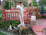 Beautiful Statue, one of many yard Figures. Gazebo in the background.