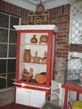 Solid Wood Book Case Cabinet Painted to match Patio Furniture filled with Terra Cotta Planters