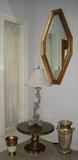 Entry View with Deco Style Gold Leaf Mirror. Short Gold Paint Round Pedestal Table, Scroll Tald Table Lamp and Urn