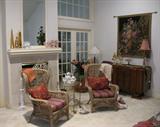 Second View of Den show wicker Chairs in Front of Fireplace with Vintage Glass & Brass Tea Cart. Antique English Sideboard with Corona Tapestry in background.