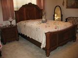 Master Bedroom Furniture with Ashley Furniture. Featuring French Style Panel Bed and Night Stand.