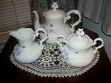 White Porcelain Teapot, Sugar & Creamer with hand painted blue flowers. 