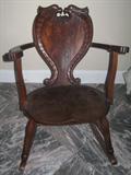 Antique Mahogany Rocker with Crouch mahogany heart shape panel back framed with Dragon style serpents