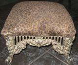 Black Wrought Iron Footstool upholstered in a faux leopard.