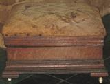 Victorian Walnut Chest-type Footstool with original finish and porcelain wheels.