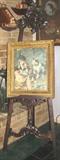 Reproduction 72" Mahogany Easel with antique print in original frame on display.