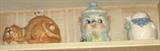 Shelf of various cookie jars