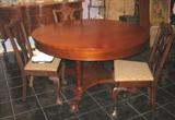 Antique Mahogany 54" Round Table with extra 12" leaf. Show with 4 Chippendale Mahogany Chairs with Claw-in-Ball feet