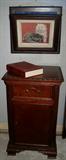 Mahogany Night Stand with Claw-and-all Feet. Above is a fold out Vicorian Wall Magazine Rack,