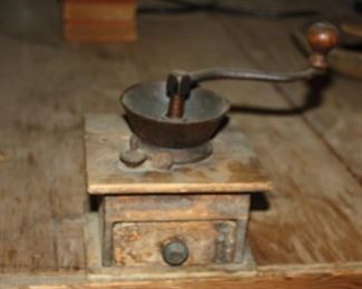 There are several antique Coffee Grinders