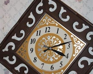 There are several vintage wall clocks