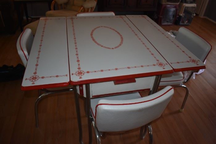 Gorgeous Chrome Red and White Drop Leaf Breakfast Table with 4 Matching Chairs.  So many inquiries on this piece that the price will be $650 or best offer on a first come first served basis. If it is not where you want to be, then leave your best offer with the Cashier. It will be sold by the end of the day.