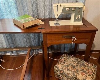 1975 Singer Sewing machine and table.