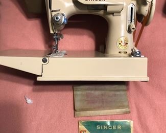 Main Level/Jewelry Counter
Singer Featherweight 221J.  With case and accessories.  Tan color.  $1200.  