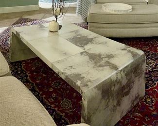 Bernhardt Coffee Table
Leather Cowhide + Stainless wrapped feet
Finish: Parchment 
Style: Post Modern Waterfall edge 