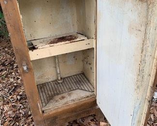 Inside view antique metal icebox