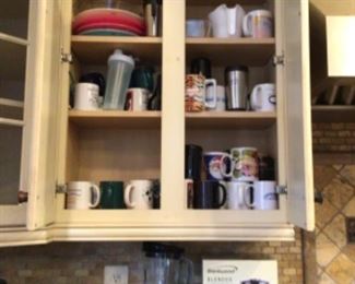 Cups , toaster, knife block, and glass ware.