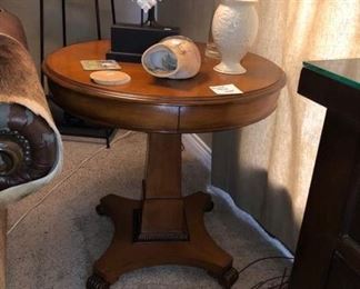 There are a pair of these pedestal lamp tables.