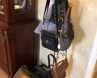 Another rack of purses