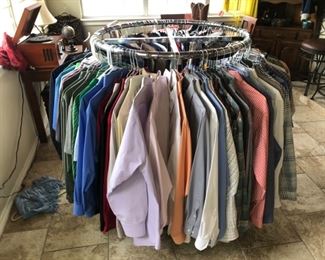 rack of men's shirts and ladies tops