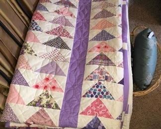 a stack of fine quilts