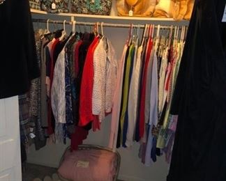 another closet full of clothing and bags