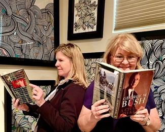 Michelle and Dale with interesting books!  Notice the Simon Kef! artwork behind them!