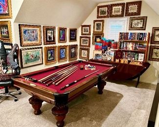 Nice billiards room packed full with books and art!