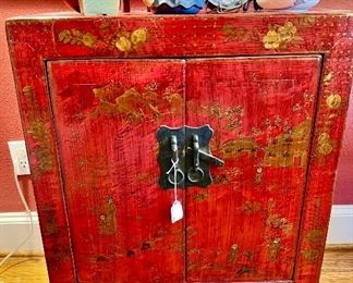 Beautiful antique Chinese lacquer cabinet with gold painting.